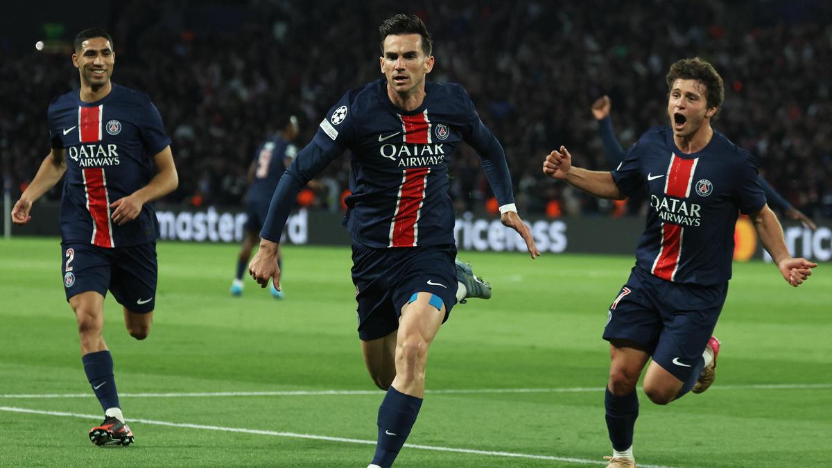 Paris Saint-Germain's Spanish midfielder #08 Fabian Ruiz (C) celebrates with his teammates Paris Saint-Germain's Moroccan defender #02 Achraf Hakimi (L) and Paris Saint-Germain's Portuguese midfielder #87 Joao Pedro Goncalves Neves (R) after scoring h
